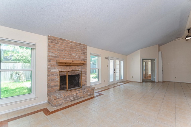 25418 Sugar Valley Ln, Spring, TX 77373 - unfurnished living room featuring light tile patterned floors, lofted ceiling, a brick fireplace, a textured ceiling, and ceiling fan