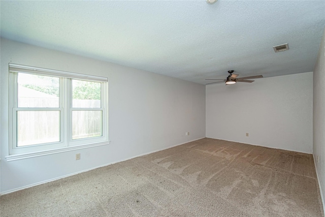 25418 Sugar Valley Ln, Spring, TX 77373 - empty room featuring a ceiling fan, carpet flooring, and a textured ceiling
