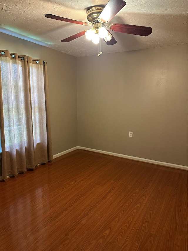 132 Grothe Ln, Houston, TX 77022 - empty room with a textured ceiling, wood finished floors, and ceiling fan