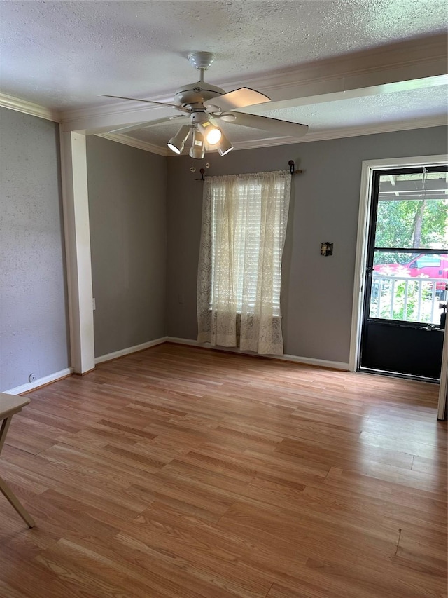 132 Grothe Ln, Houston, TX 77022 - unfurnished room with crown molding, wood finished floors, ceiling fan, and a textured ceiling
