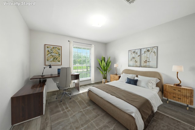 8503 Leader St, Houston, TX 77036 - bedroom featuring wood finished floors and a desk