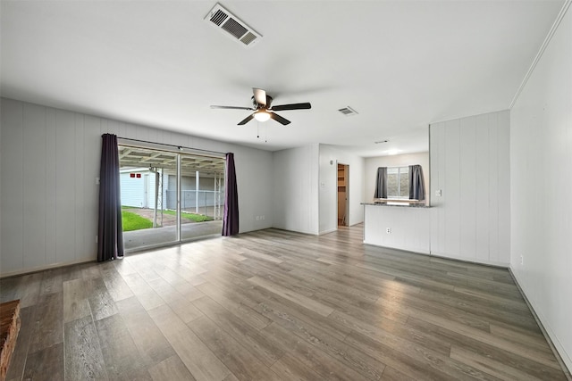 8503 Leader St, Houston, TX 77036 - unfurnished living room with ceiling fan and wood finished floors