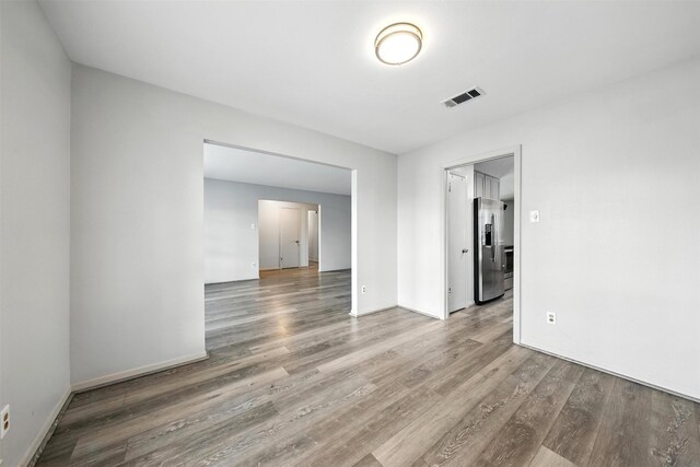 8503 Leader St, Houston, TX 77036 - spare room featuring wood finished floors and baseboards