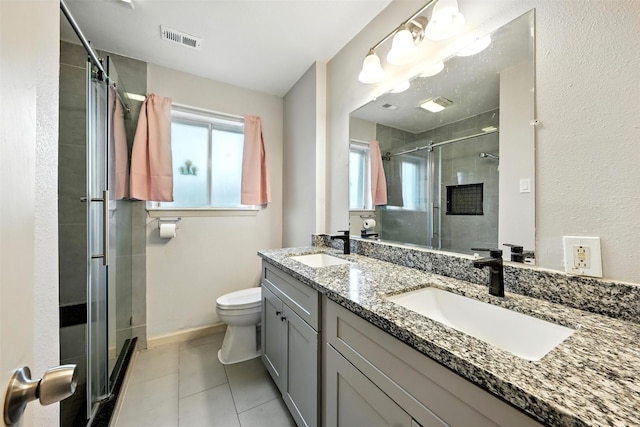 8503 Leader St, Houston, TX 77036 - bathroom featuring a shower stall, double vanity, and healthy amount of natural light