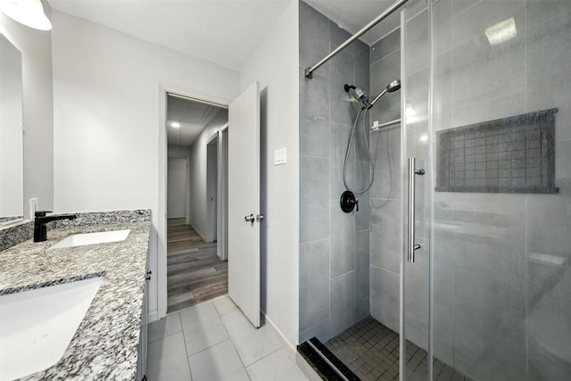 8503 Leader St, Houston, TX 77036 - bathroom with a shower stall, double vanity, and tile patterned floors