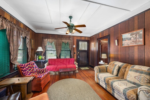 600 Brazos St, Glidden, TX 78943 - living room with wooden walls, ceiling fan, and wood finished floors