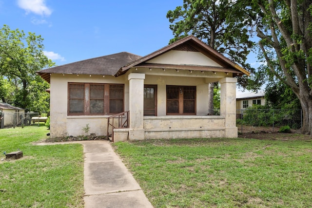 600 Brazos St, Glidden, TX 78943 - bungalow-style home with stucco siding and roof with shingles