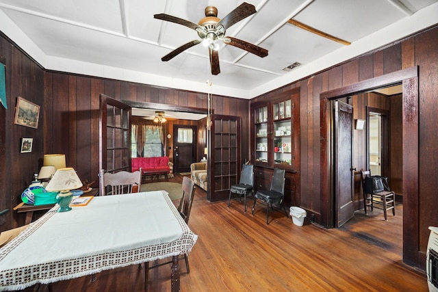 600 Brazos St, Glidden, TX 78943 - office space featuring a ceiling fan, wood walls, and wood finished floors