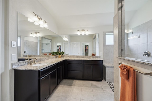 1502 Trails Of Katy Ln, Katy, TX 77494 - bathroom with tile patterned floors, walk in shower, double vanity, and lofted ceiling