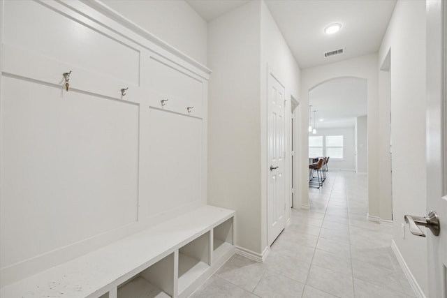 1502 Trails Of Katy Ln, Katy, TX 77494 - mudroom with arched walkways and light tile patterned floors