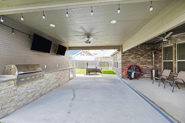 1502 Trails Of Katy Ln, Katy, TX 77494 - view of patio featuring ceiling fan and exterior kitchen