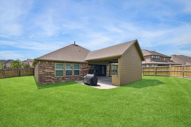 1502 Trails Of Katy Ln, Katy, TX 77494 - rear view of house featuring a patio area, a fenced backyard, a shingled roof, and brick siding
