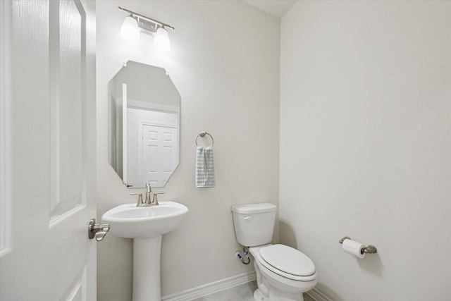 1502 Trails Of Katy Ln, Katy, TX 77494 - half bathroom with toilet and baseboards