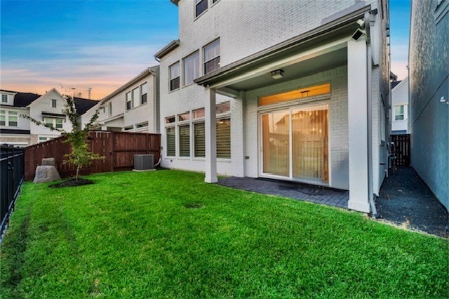 3615 Weston Manor Ln, Houston, TX 77055 - rear view of house with a fenced backyard and brick siding