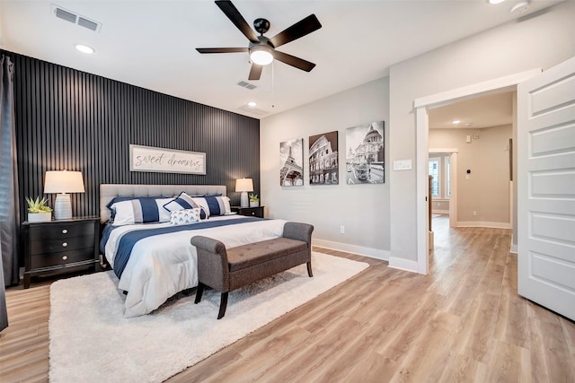 3615 Weston Manor Ln, Houston, TX 77055 - bedroom with an accent wall, light wood-type flooring, recessed lighting, and a ceiling fan