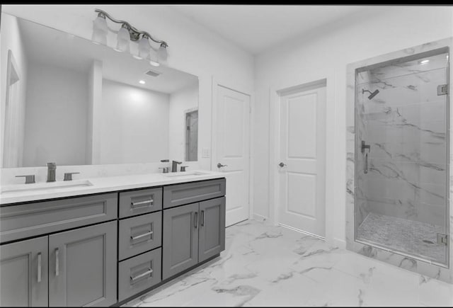 209 Edgewood St Unit C, Houston, TX 77011 - bathroom with a marble finish shower, double vanity, marble finish floors, and recessed lighting