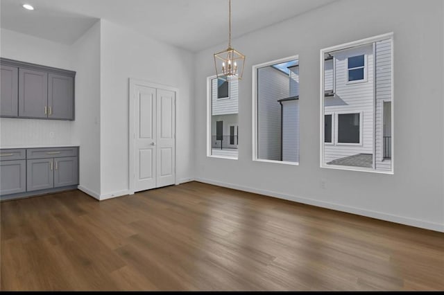209 Edgewood St Unit C, Houston, TX 77011 - unfurnished dining area with a chandelier, dark wood finished floors, and recessed lighting
