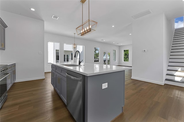 209 Edgewood St Unit C, Houston, TX 77011 - kitchen with stainless steel appliances, gray cabinetry, light countertops, dark wood-style flooring, and recessed lighting