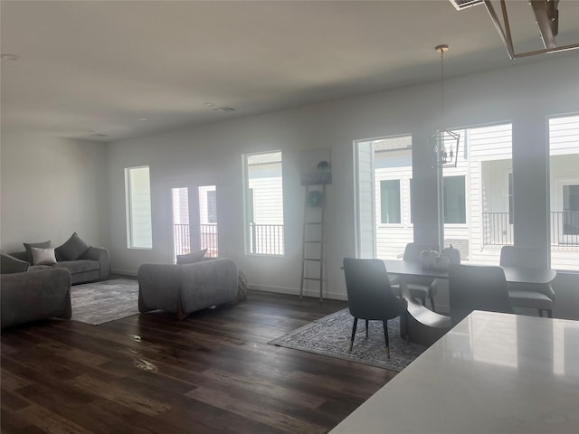 209 Edgewood St Unit C, Houston, TX 77011 - dining space featuring plenty of natural light, dark wood-type flooring, and a chandelier