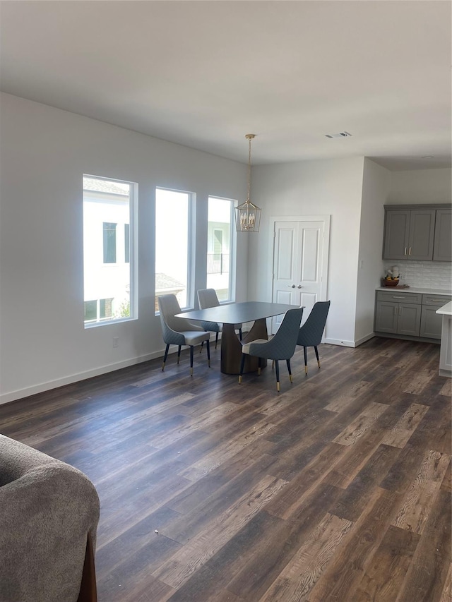 209 Edgewood St Unit C, Houston, TX 77011 - dining room featuring dark wood-style flooring and a chandelier