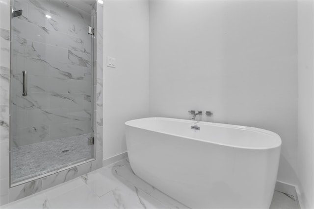 209 Edgewood St Unit C, Houston, TX 77011 - full bath with marble finish floors, a marble finish shower, and a soaking tub
