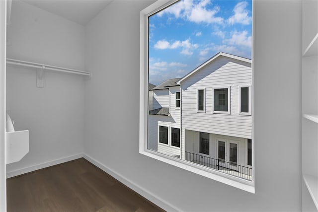 209 Edgewood St Unit C, Houston, TX 77011 - spacious closet featuring dark wood-style floors