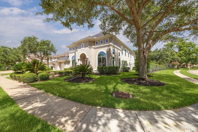 5215 Eagle Pointe Ct, Sugar Land, TX 77479 - mediterranean / spanish home with stucco siding and a front yard