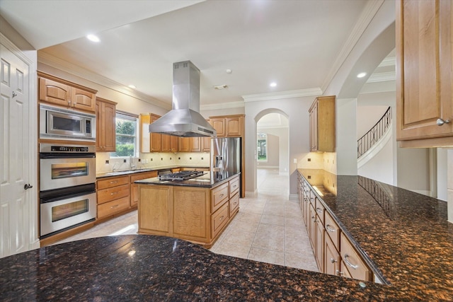 5215 Eagle Pointe Ct, Sugar Land, TX 77479 - kitchen featuring island exhaust hood, stainless steel appliances, arched walkways, tasteful backsplash, and dark stone countertops
