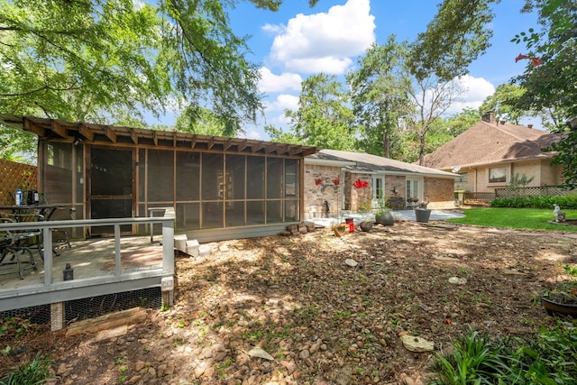 150 Greenbriar Dr, Montgomery, TX 77356 - back of house with a sunroom and a deck