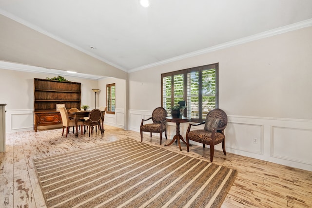 150 Greenbriar Dr, Montgomery, TX 77356 - living area with hardwood / wood-style floors, a decorative wall, ornamental molding, a wainscoted wall, and lofted ceiling