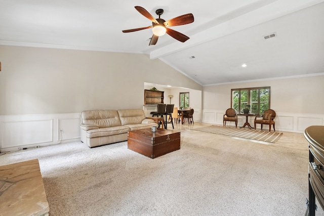 150 Greenbriar Dr, Montgomery, TX 77356 - carpeted living room featuring a decorative wall, a ceiling fan, wainscoting, and ornamental molding