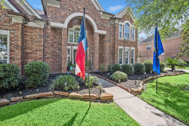 18718 Glenn Haven Estates Dr, Spring, TX 77379 - view of front facade with brick siding and a front yard