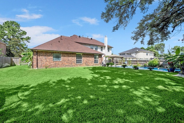 18718 Glenn Haven Estates Dr, Spring, TX 77379 - rear view of house with a fenced backyard, a gazebo, brick siding, and an outdoor pool