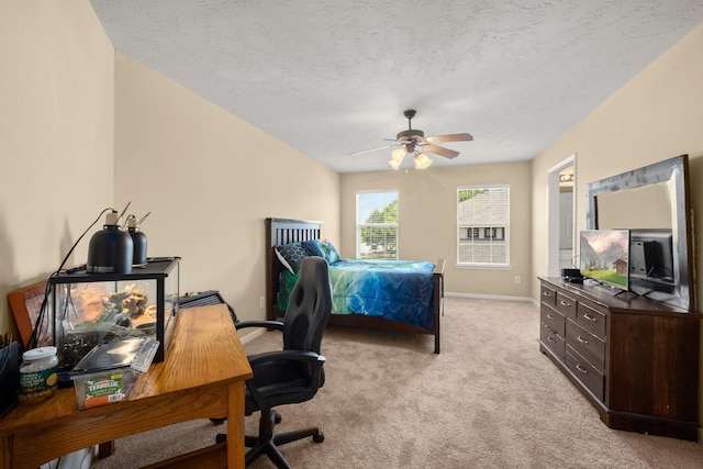 18718 Glenn Haven Estates Dr, Spring, TX 77379 - bedroom featuring light carpet, a desk, a ceiling fan, and a textured ceiling