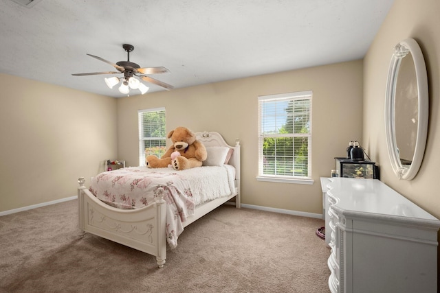 18718 Glenn Haven Estates Dr, Spring, TX 77379 - bedroom with light carpet, multiple windows, and ceiling fan