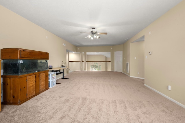 18718 Glenn Haven Estates Dr, Spring, TX 77379 - unfurnished living room with ceiling fan and carpet floors