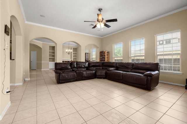 18718 Glenn Haven Estates Dr, Spring, TX 77379 - living area with a ceiling fan, built in shelves, ornamental molding, arched walkways, and a chandelier