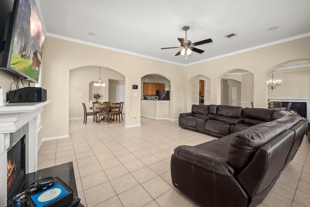 18718 Glenn Haven Estates Dr, Spring, TX 77379 - living room with a premium fireplace, light tile patterned floors, crown molding, a ceiling fan, and arched walkways