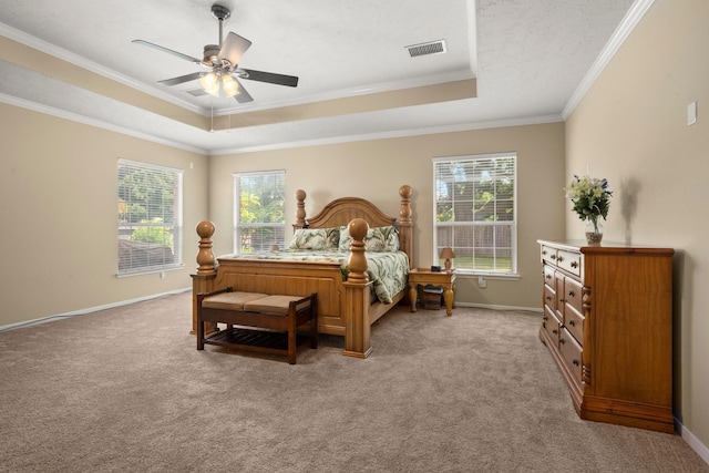 18718 Glenn Haven Estates Dr, Spring, TX 77379 - bedroom with a tray ceiling, crown molding, light carpet, and a ceiling fan