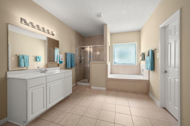 18718 Glenn Haven Estates Dr, Spring, TX 77379 - full bathroom with vanity, a stall shower, a garden tub, and tile patterned flooring