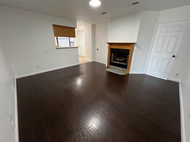 10447 Winding Trail Rd, La Porte, TX 77571 - unfurnished living room with a fireplace with flush hearth and wood finished floors