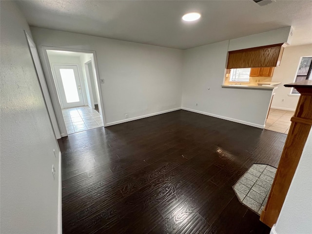 10447 Winding Trail Rd, La Porte, TX 77571 - unfurnished living room with wood finished floors and baseboards