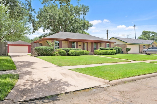 10447 Winding Trail Rd, La Porte, TX 77571 - ranch-style home featuring brick siding, an outdoor structure, and a garage