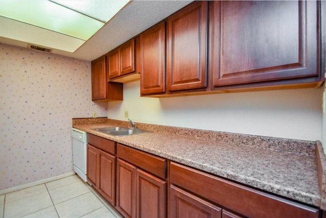 2818 S Bartell Dr S Unit 6, Houston, TX 77054 - kitchen with dishwasher, wallpapered walls, light countertops, light tile patterned floors, and brown cabinets