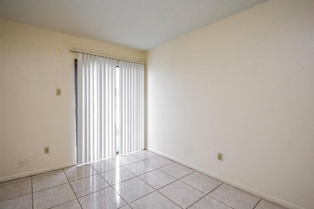 2818 S Bartell Dr S Unit 6, Houston, TX 77054 - spare room featuring healthy amount of natural light and light tile patterned floors
