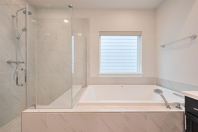 5308 S Capitol St, Houston, TX 77023 - full bath featuring a garden tub, a stall shower, and vanity