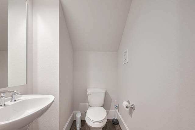 5308 S Capitol St, Houston, TX 77023 - half bathroom with wood finished floors and lofted ceiling