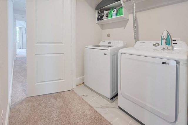 5308 S Capitol St, Houston, TX 77023 - laundry area with independent washer and dryer and light marble finish flooring