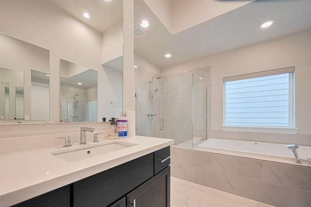 5308 S Capitol St, Houston, TX 77023 - full bathroom with a garden tub, a marble finish shower, vanity, and recessed lighting