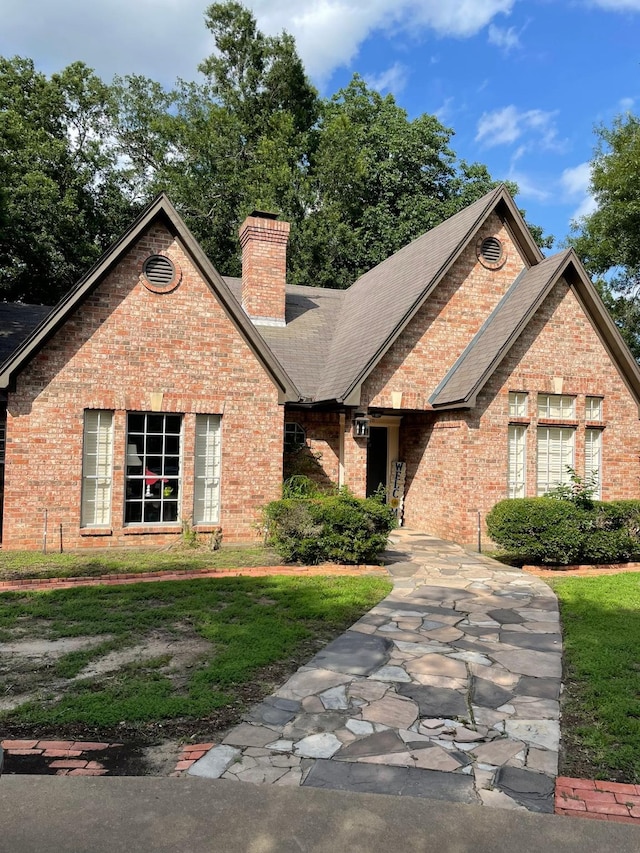 1200 Mary Lee Ln, Crockett, TX 75835 - view of front of home with brick siding, a chimney, a shingled roof, and a front yard